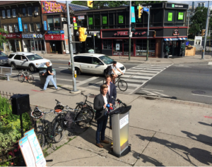 Councillor Joe Cressy announces Tour de Bloor (Bike and Buy) Passport. 