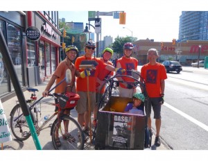 Wayne Scott (behind his cargo bike) during community clean up of bike lane after installation, Aug 2016.